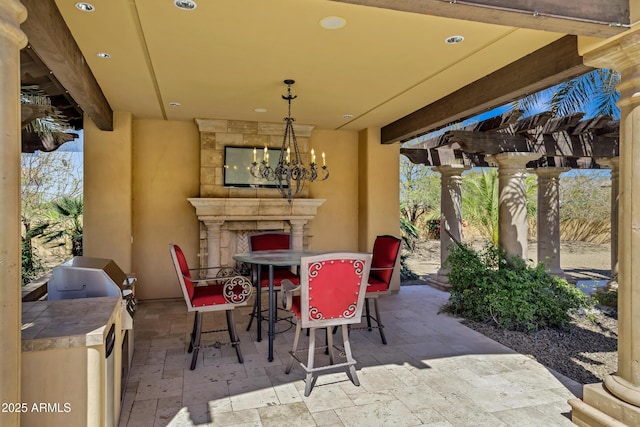10894 E Turquoise Ave, Scottsdale, AZ 85259 - view of patio / terrace featuring area for grilling, a fireplace, and outdoor dining area