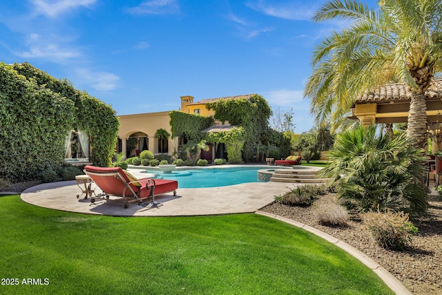 10894 E Turquoise Ave, Scottsdale, AZ 85259 - view of swimming pool with a lawn, a pool with connected hot tub, and a patio area