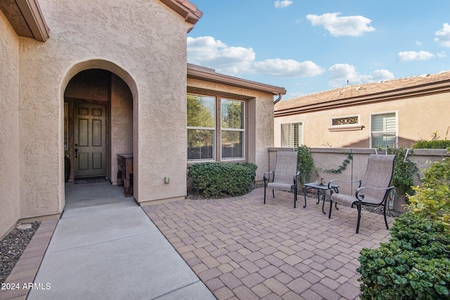 doorway to property with a patio