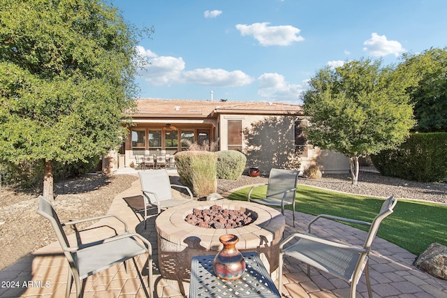 view of patio featuring an outdoor fire pit