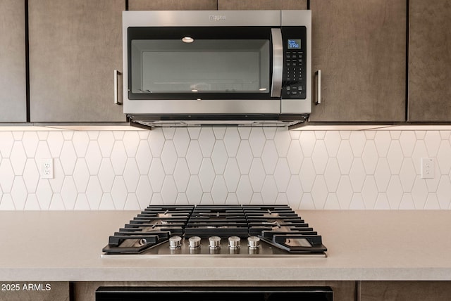 kitchen featuring backsplash and appliances with stainless steel finishes