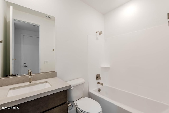 full bathroom featuring toilet, vanity, and bathing tub / shower combination