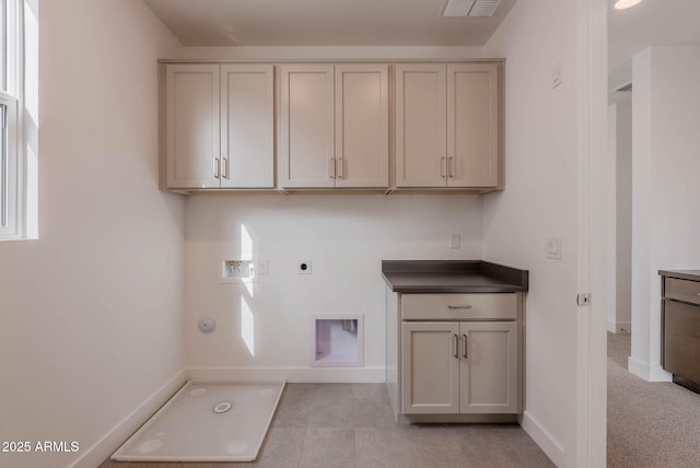 laundry area featuring washer hookup, cabinets, gas dryer hookup, and electric dryer hookup