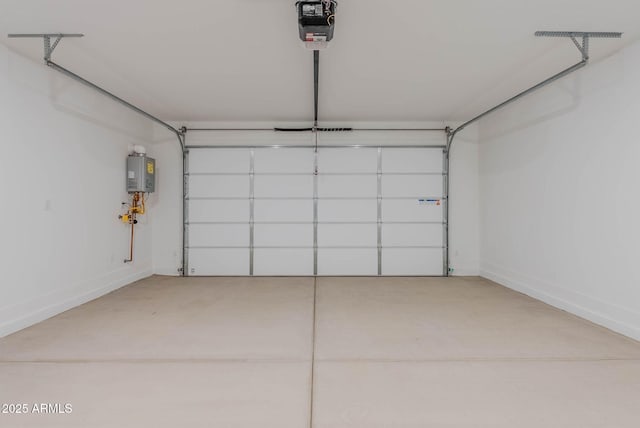 garage with water heater and a garage door opener