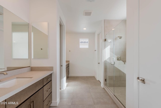 bathroom featuring walk in shower and vanity