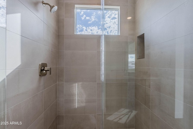 bathroom with a tile shower