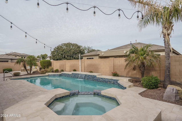 view of swimming pool with an in ground hot tub and pool water feature