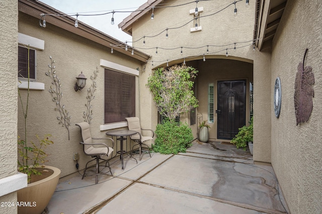 property entrance with a patio area