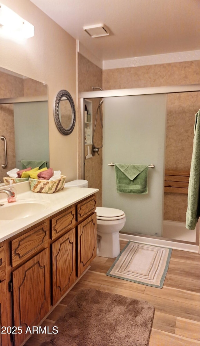 2064 S Farnsworth Dr Unit 38, Mesa, AZ 85209 - bathroom with vanity, a shower stall, and wood finished floors
