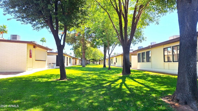 2064 S Farnsworth Dr Unit 38, Mesa, AZ 85209 - view of green lawn featuring central air condition unit