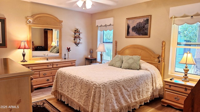 2064 S Farnsworth Dr Unit 38, Mesa, AZ 85209 - bedroom featuring light wood-type flooring and a ceiling fan