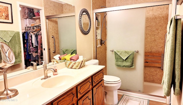 2064 S Farnsworth Dr Unit 38, Mesa, AZ 85209 - bathroom featuring toilet, vanity, a stall shower, and a walk in closet