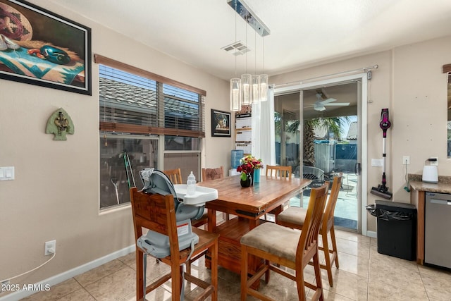 dining space with light tile patterned floors, baseboards, and visible vents