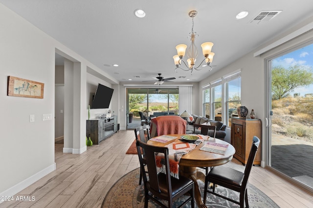 dining area with recessed lighting, ceiling fan with notable chandelier, visible vents, baseboards, and light wood-type flooring