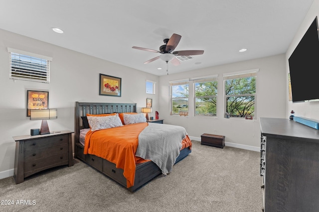 bedroom with a ceiling fan, recessed lighting, light carpet, and baseboards