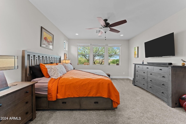 bedroom featuring recessed lighting, light colored carpet, ceiling fan, and baseboards