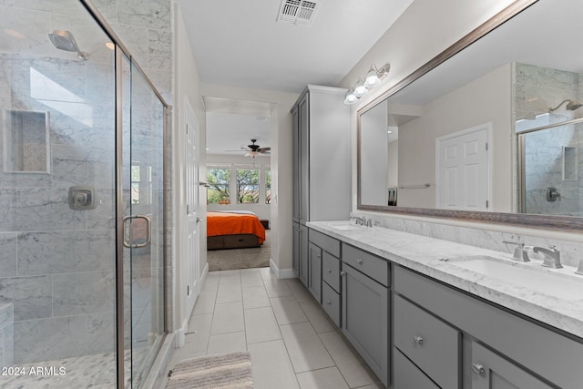 ensuite bathroom featuring a stall shower, ensuite bath, visible vents, and a sink