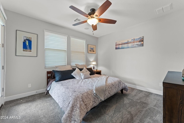 bedroom with ceiling fan, carpet flooring, visible vents, and baseboards