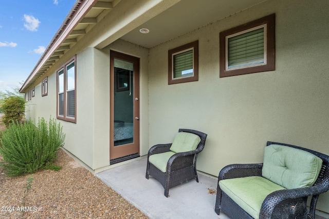 exterior space with a patio area and stucco siding