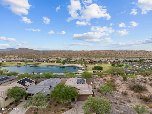 drone / aerial view with a residential view and a water and mountain view