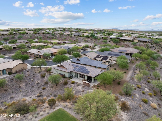 drone / aerial view featuring a residential view and a mountain view