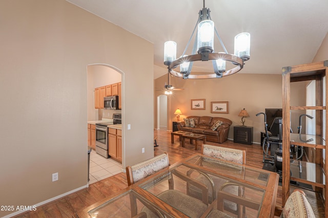 living room with lofted ceiling and light hardwood / wood-style flooring