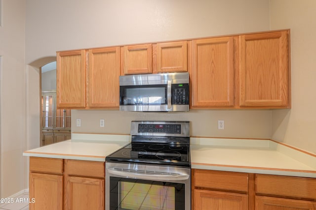 kitchen with stainless steel appliances and light brown cabinets