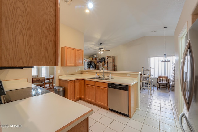 kitchen featuring pendant lighting, sink, stainless steel appliances, a healthy amount of sunlight, and kitchen peninsula