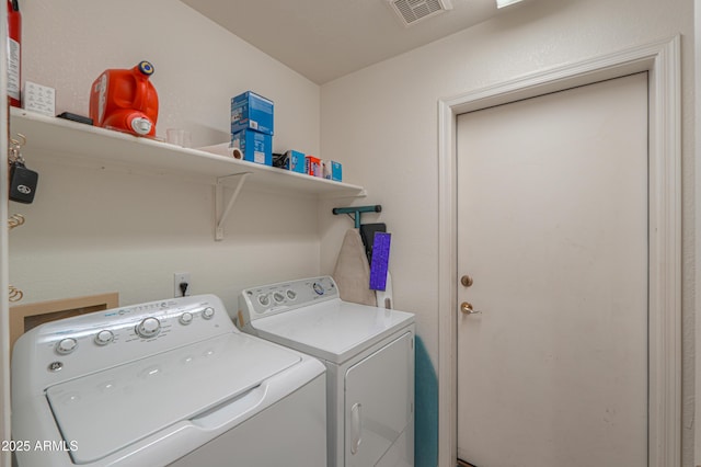 laundry area with washing machine and dryer