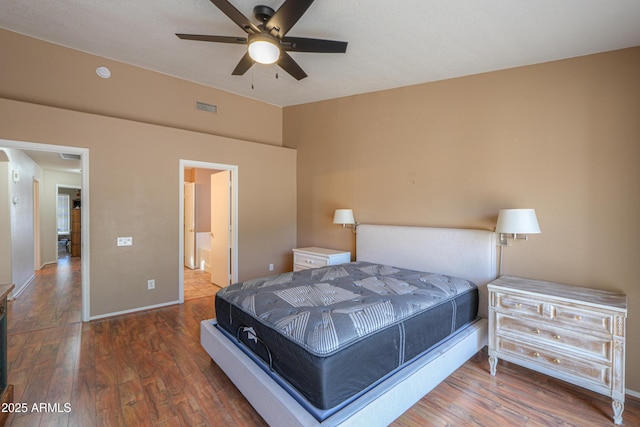 bedroom with dark hardwood / wood-style floors