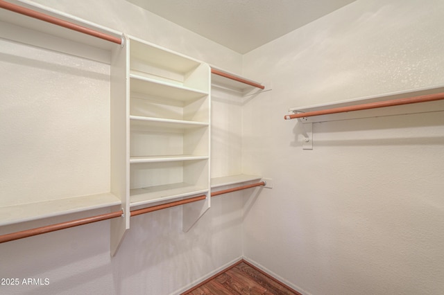 spacious closet featuring hardwood / wood-style floors