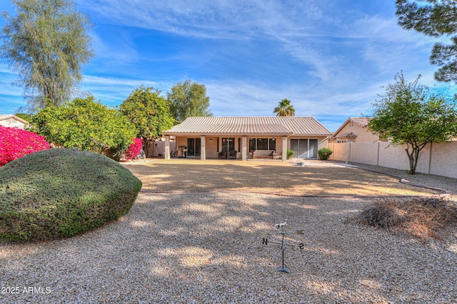 ranch-style house featuring a patio