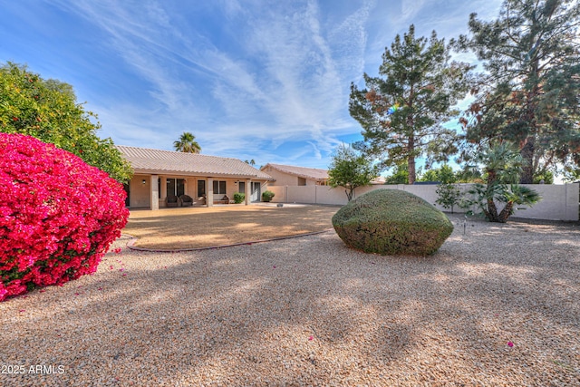 ranch-style house featuring a patio