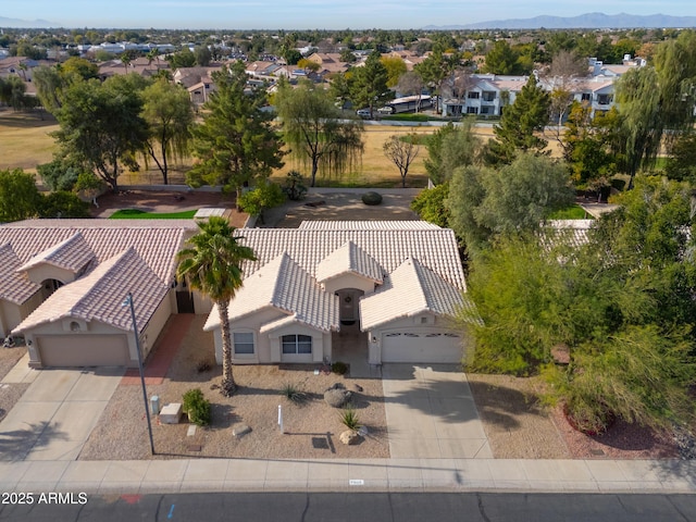 birds eye view of property with a mountain view