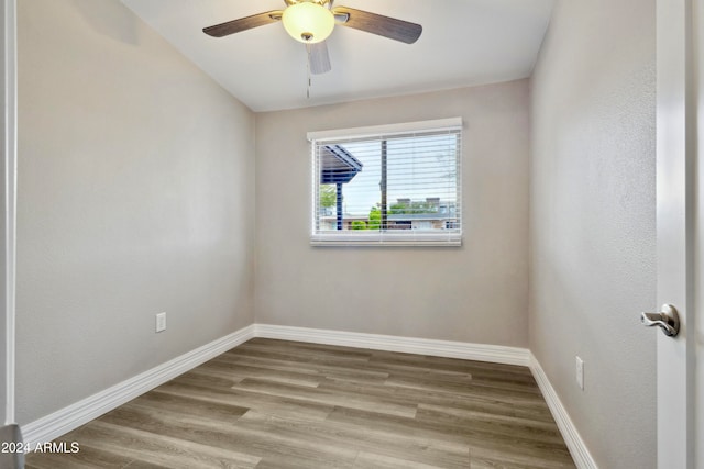 spare room featuring light hardwood / wood-style floors and ceiling fan