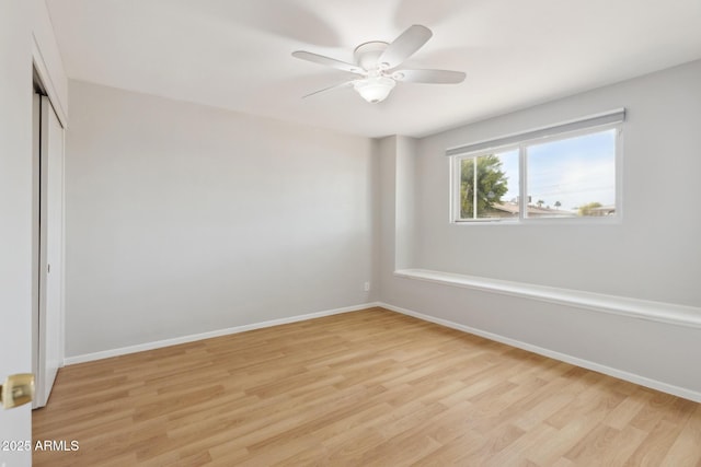 8301 E Indianola Ave, Scottsdale, AZ 85251 - unfurnished bedroom featuring light wood finished floors, baseboards, a closet, and ceiling fan