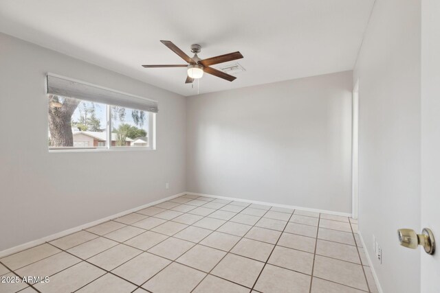 8301 E Indianola Ave, Scottsdale, AZ 85251 - empty room with a ceiling fan, baseboards, and light tile patterned floors