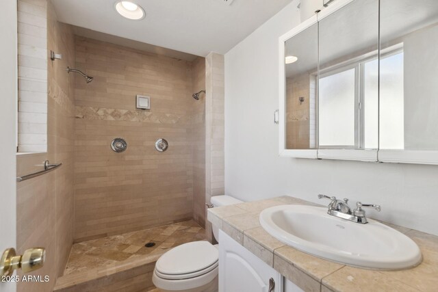 8301 E Indianola Ave, Scottsdale, AZ 85251 - bathroom with toilet, a tile shower, and vanity