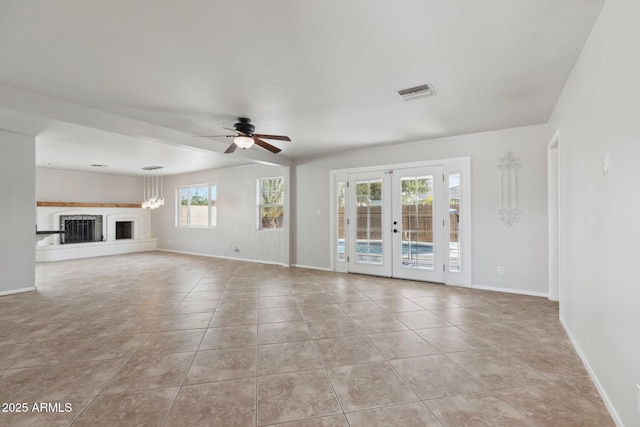 8301 E Indianola Ave, Scottsdale, AZ 85251 - unfurnished living room featuring plenty of natural light and baseboards