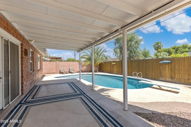 8301 E Indianola Ave, Scottsdale, AZ 85251 - view of pool with a patio, a fenced backyard, and a diving board