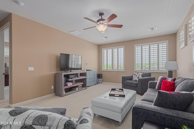 living room with light carpet and ceiling fan