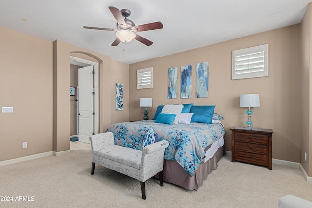 carpeted bedroom with ceiling fan