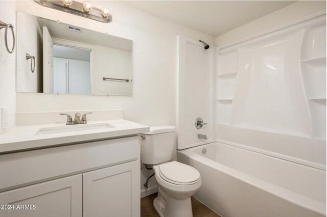 full bathroom featuring shower / bathtub combination, vanity, and toilet