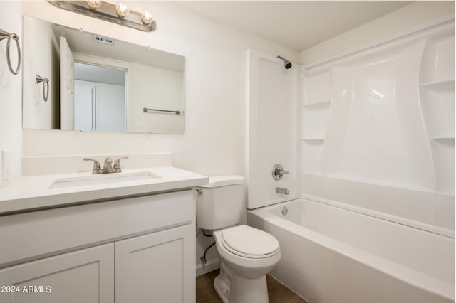 full bathroom with vanity, toilet, and washtub / shower combination