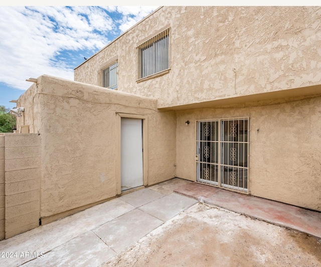 rear view of property with a patio area