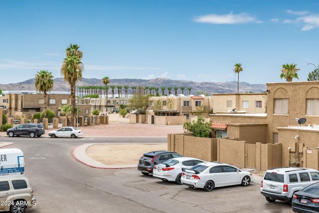 view of parking / parking lot featuring a mountain view