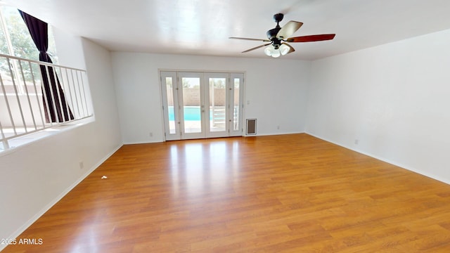 8541 W Pershing Ave, Peoria, AZ 85381 - empty room with ceiling fan, light wood finished floors, and french doors