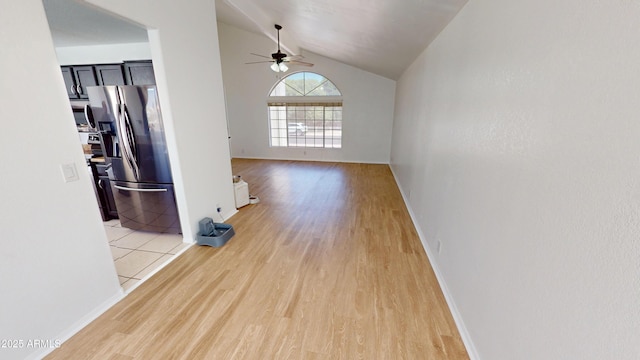 8541 W Pershing Ave, Peoria, AZ 85381 - unfurnished living room featuring ceiling fan, light wood-style flooring, and vaulted ceiling