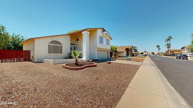 8541 W Pershing Ave, Peoria, AZ 85381 - view of front facade featuring a garage, driveway, and stucco siding