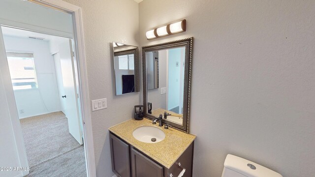 8541 W Pershing Ave, Peoria, AZ 85381 - bathroom featuring vanity and a textured wall